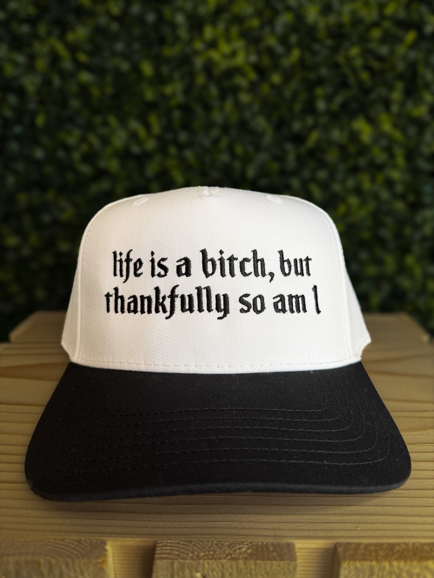 LIFE IS A B*TCH TRUCKER HAT