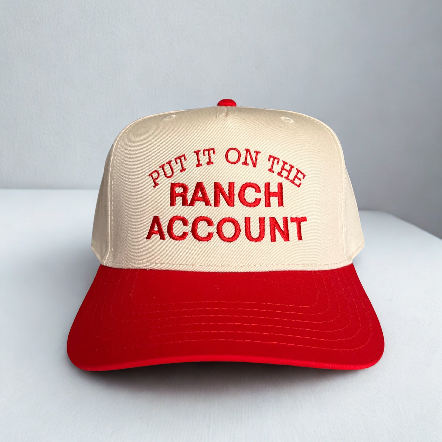 PUT IT ON THE RANCH ACCOUNT TRUCKER HAT